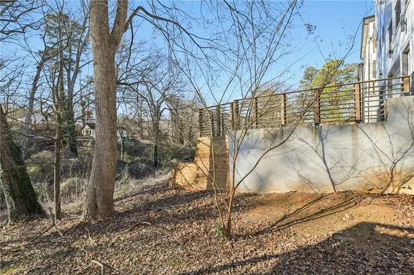 a balcony with furniture and wooden floor
