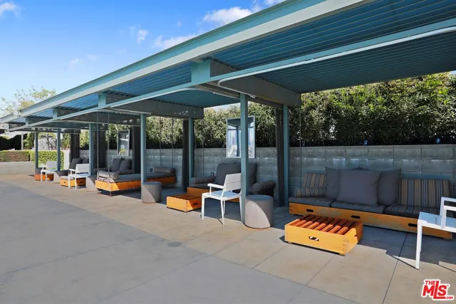 a view of a chairs and tables in the patio