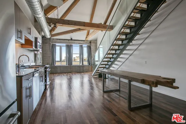 a view of a entryway with wooden floor and front door