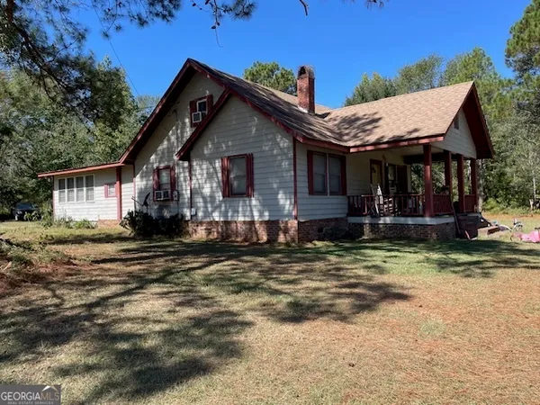 a front view of a house with a porch