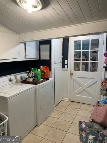 a living room with furniture a rug and a window