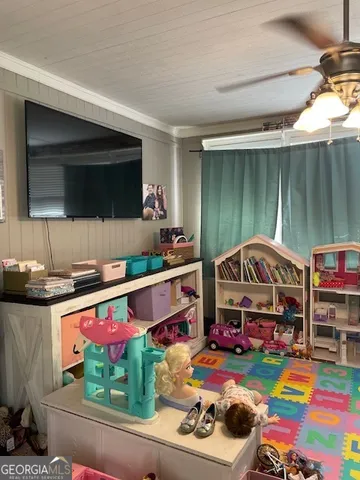 a backyard of a house with barbeque oven and outdoor seating