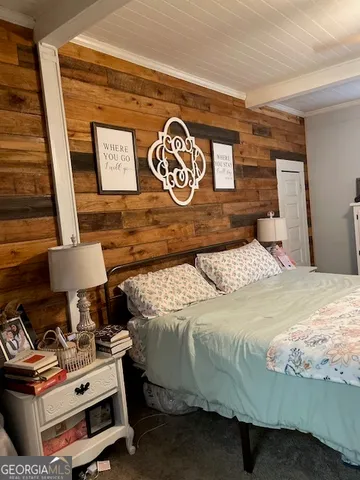 a bedroom with a bed and a table in it