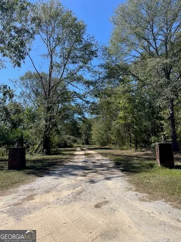 a view of a workspace with furniture and wooden floor