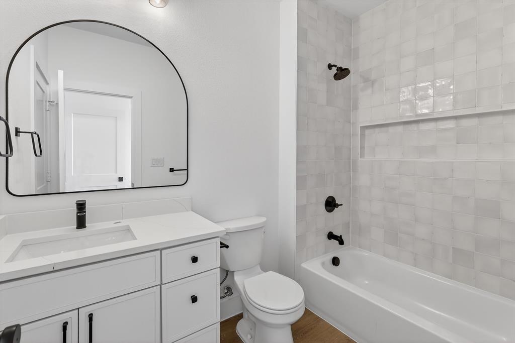 2835 Macon Street Dallas, TX 75215 - Photo 11 of 14 a bathroom with a sink toilet and shower