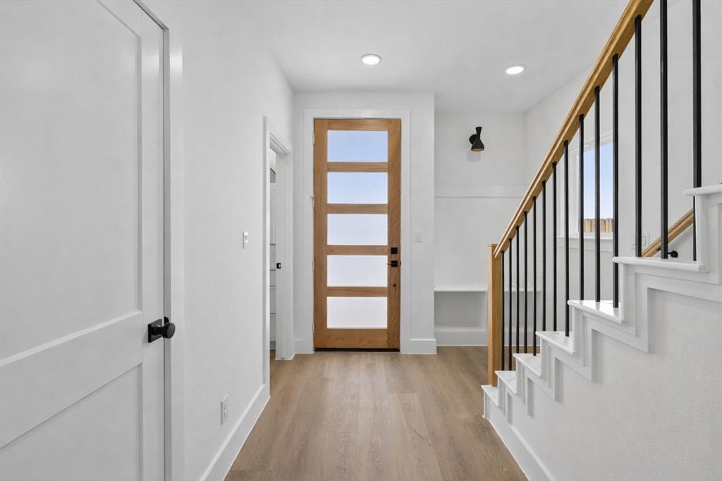 2835 Macon Street Dallas, TX 75215 - Photo 3 of 14 a view of an entryway with wooden floor and stairs