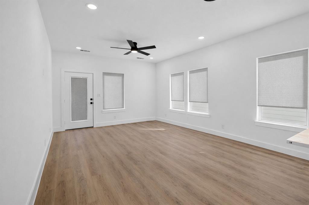 2835 Macon Street Dallas, TX 75215 - Photo 7 of 14 a view of empty room with wooden floor and fan