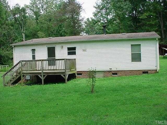 12517 Roxboro Road Rougemont, NC 27572 - Photo 2 of 3 a view of a house with a backyard