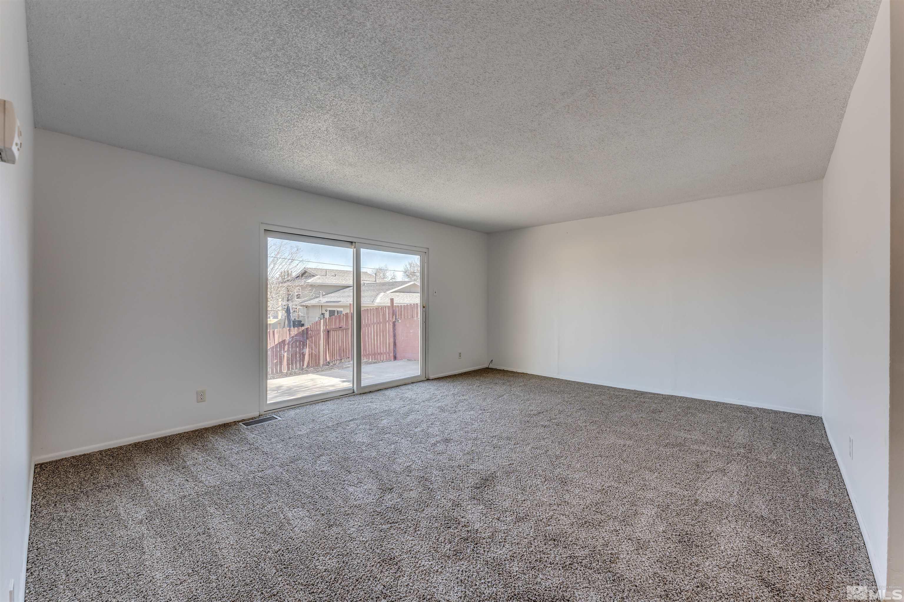 658 Beldon Way Reno, NV 89503 - Photo 3 of 21 an empty room with windows