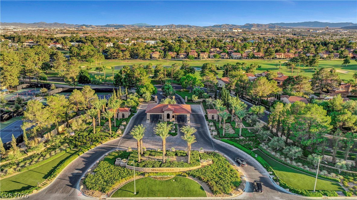 7995 Rio Rico Drive Las Vegas, NV 89113 - Photo 76 of 92 A grand gated entrance welcomes residents to a verdant community with tennis courts and a golf course.