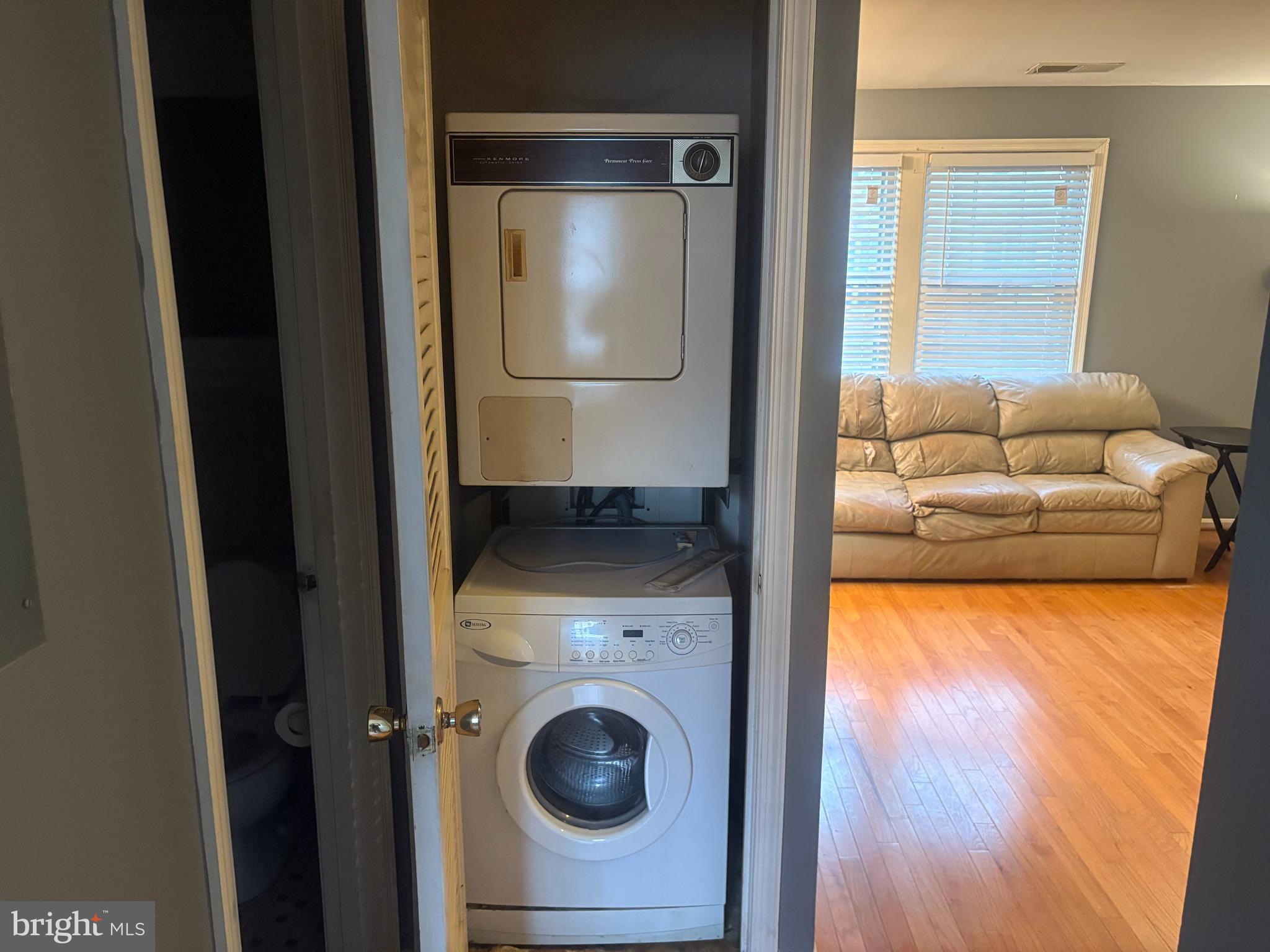 2107 Fort Davis Street Southeast, Unit 202 Washington, DC 20020 - Photo 4 of 5 a view of a livingroom with furniture and a gate