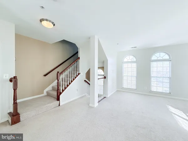 a view of an empty room with windows