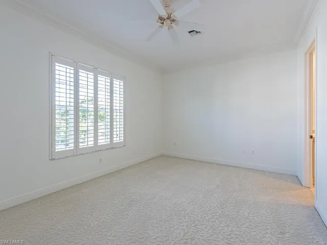 a bathroom with a sink mirror and toilet
