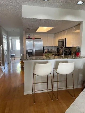 a view of empty room with a fireplace