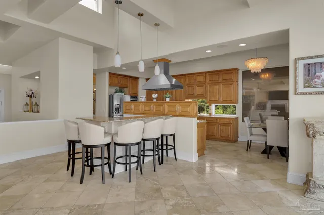 a spacious bathroom with a granite countertop sink a mirror and a bathtub