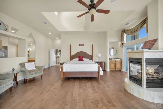 a living room with furniture cabinets and a window