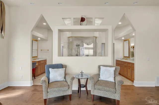 a view of a dining room with furniture and a chandelier