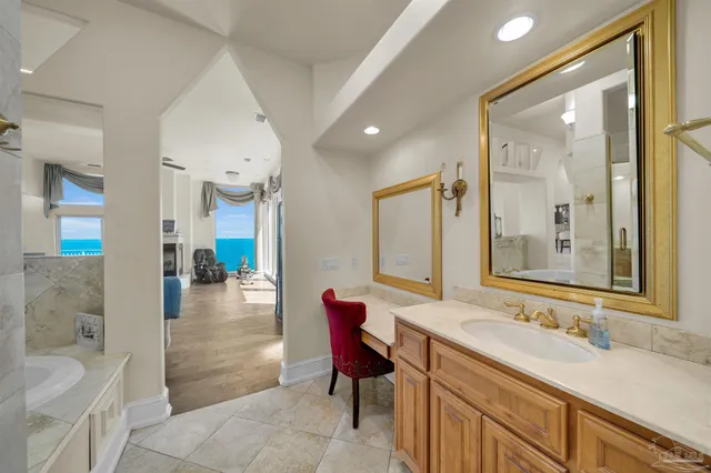 a large kitchen with stainless steel appliances granite countertop a stove a sink and a refrigerator