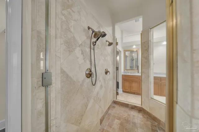 a kitchen with stainless steel appliances granite countertop a sink dishwasher stove and refrigerator