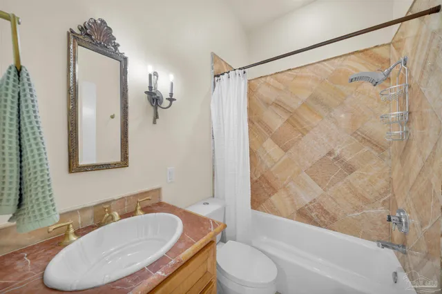 a bed room with a bed furniture and a flat screen tv