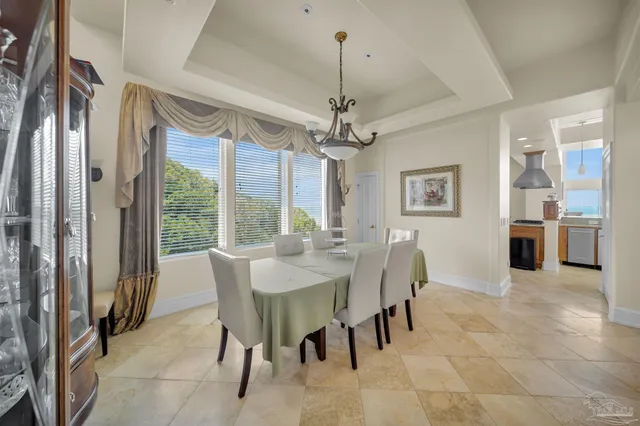 a spacious bathroom with a granite countertop sink a toilet and a mirror