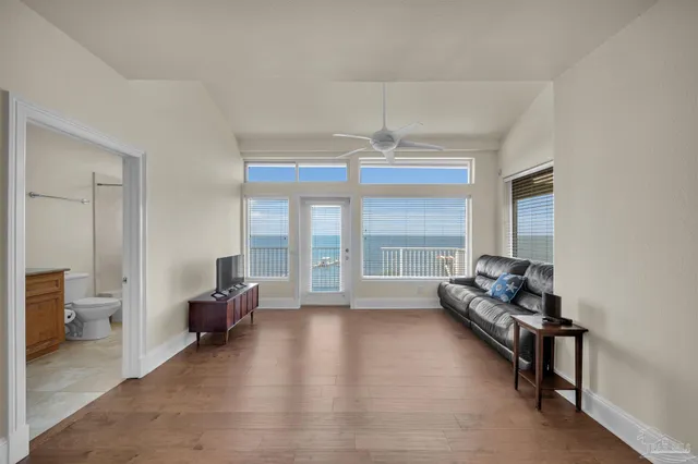 an aerial view of a house with a garden and lake view