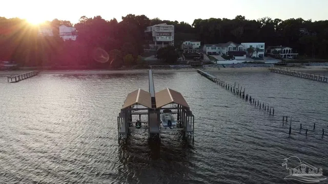 a kitchen with stainless steel appliances granite countertop a sink and a refrigerator