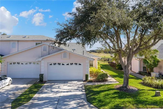 a large tree in front of the house