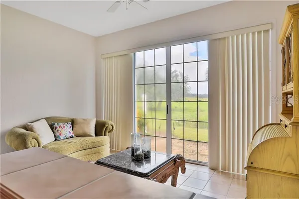 a kitchen with a sink a stove top oven and white cabinets
