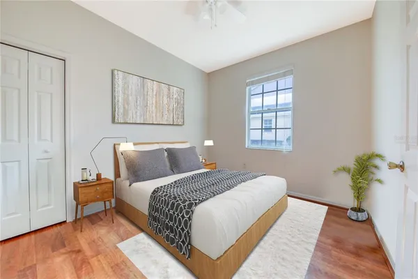 a bedroom with a bed and a chandelier