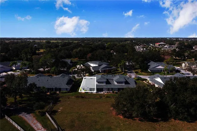 a view of a back yard of the house and an empty space