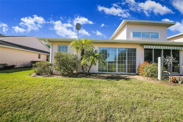 a view of a lake with houses swimming pool and outdoor space