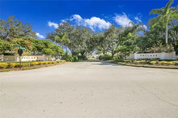a front view of a house with a yard and a garage