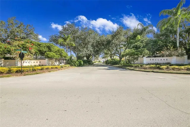 a front view of a house with a yard and a garage