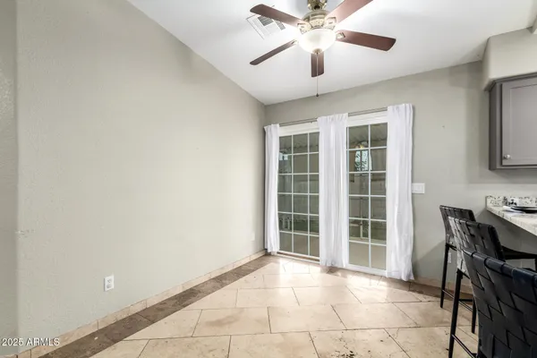 a view of livingroom with furniture and ceiling fan