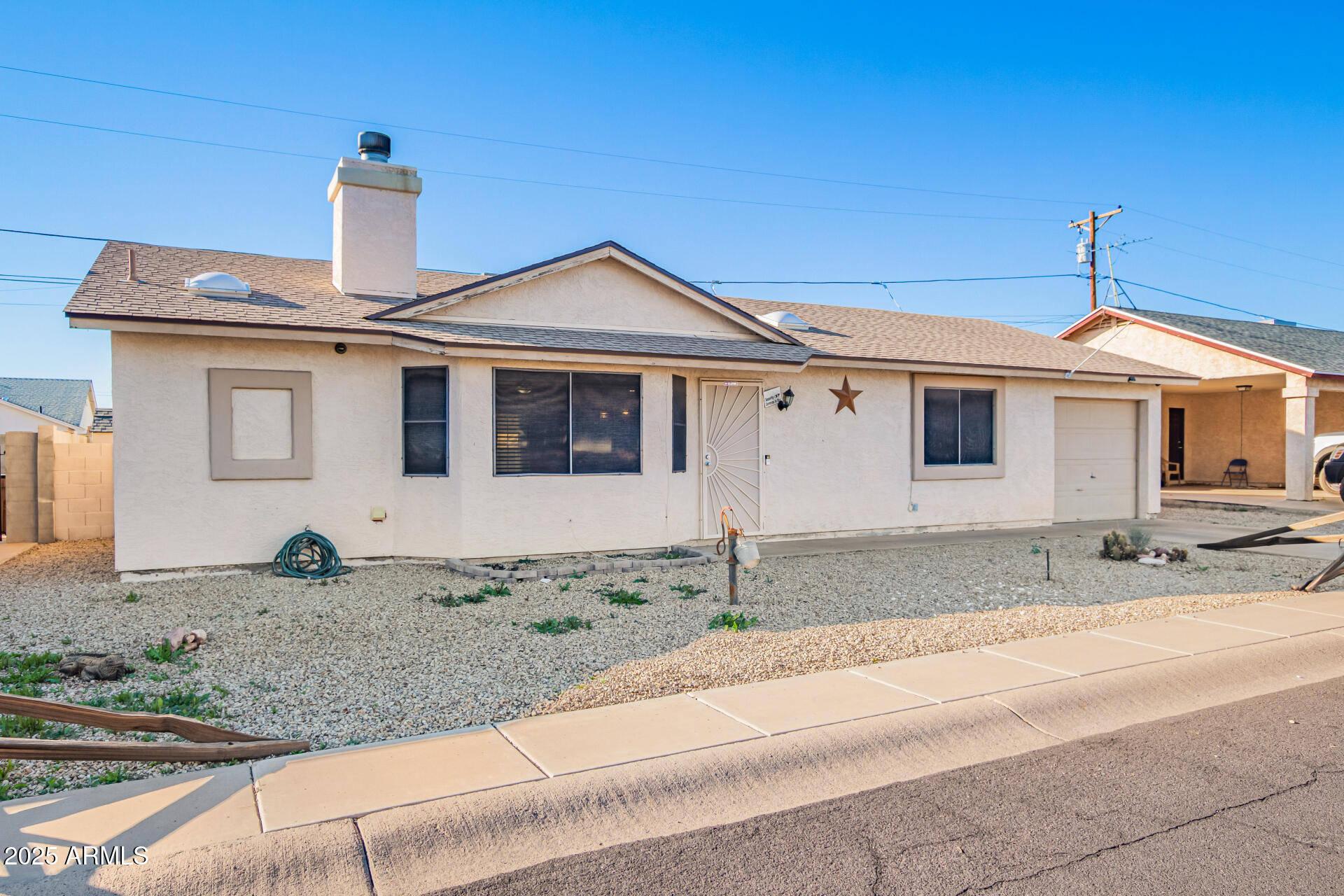 540 South Stardust Lane Apache Junction, AZ 85120 - Photo 2 of 32 a front view of a house with garden