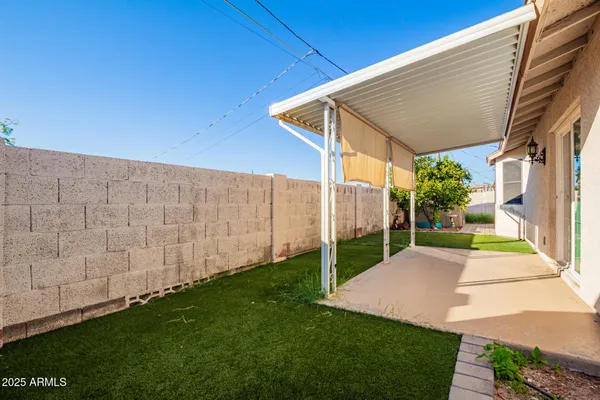 a view of backyard with green space
