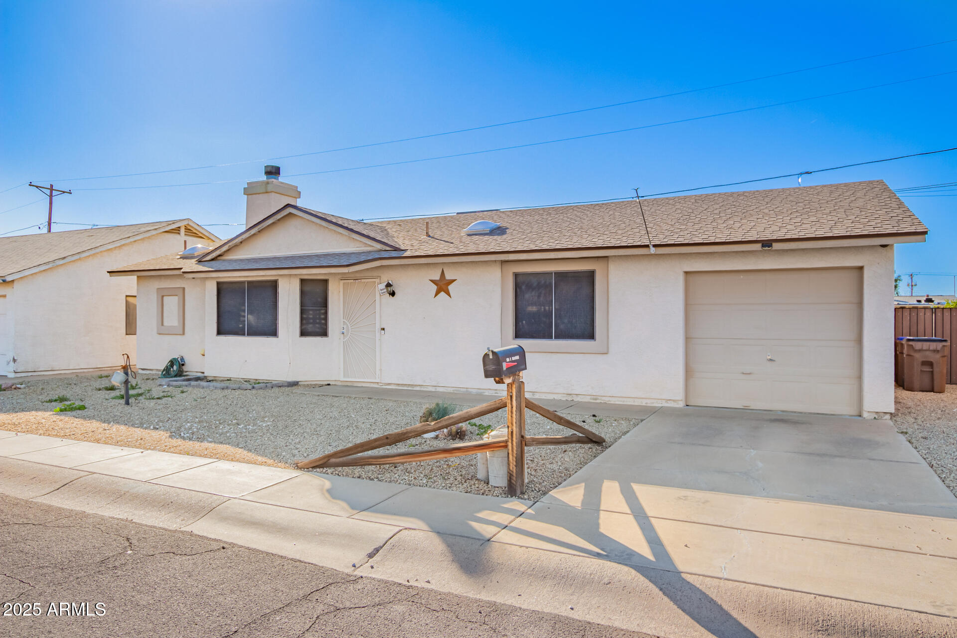 540 South Stardust Lane Apache Junction, AZ 85120 - Photo 3 of 32 a front view of a house with a garage