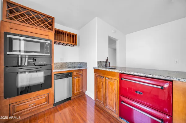 a kitchen with stainless steel appliances granite countertop a stove and a sink