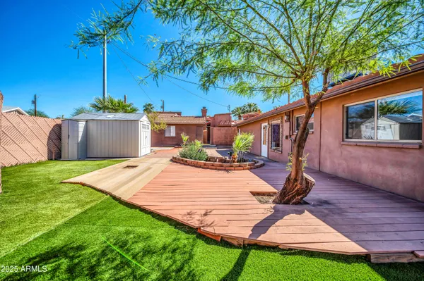 a view of a backyard with a patio