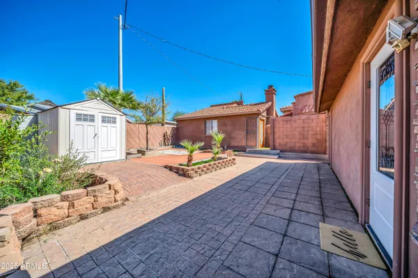 a view of a backyard with a patio