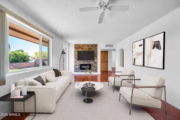 an aerial view of residential houses with outdoor space and street view