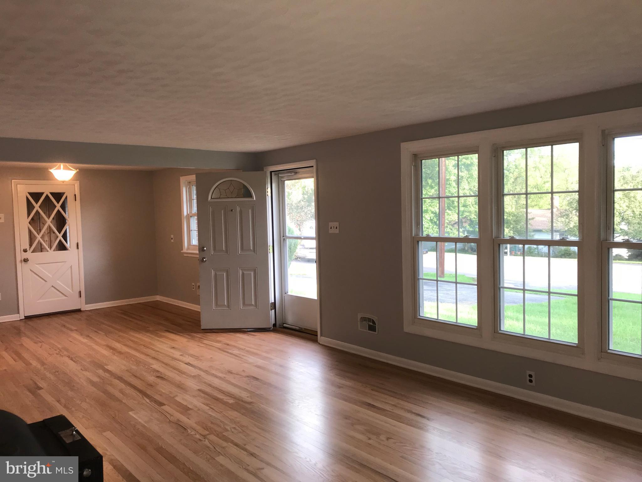 1870 Church Road York, PA 17408 - Photo 8 of 35 Living area/dining room with hardwood flooring.