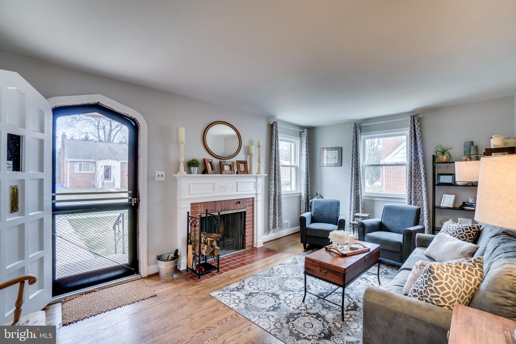 10003 Greeley Avenue Silver Spring, MD 20902 - Photo 2 of 27 Family room with wood-burning fireplace.