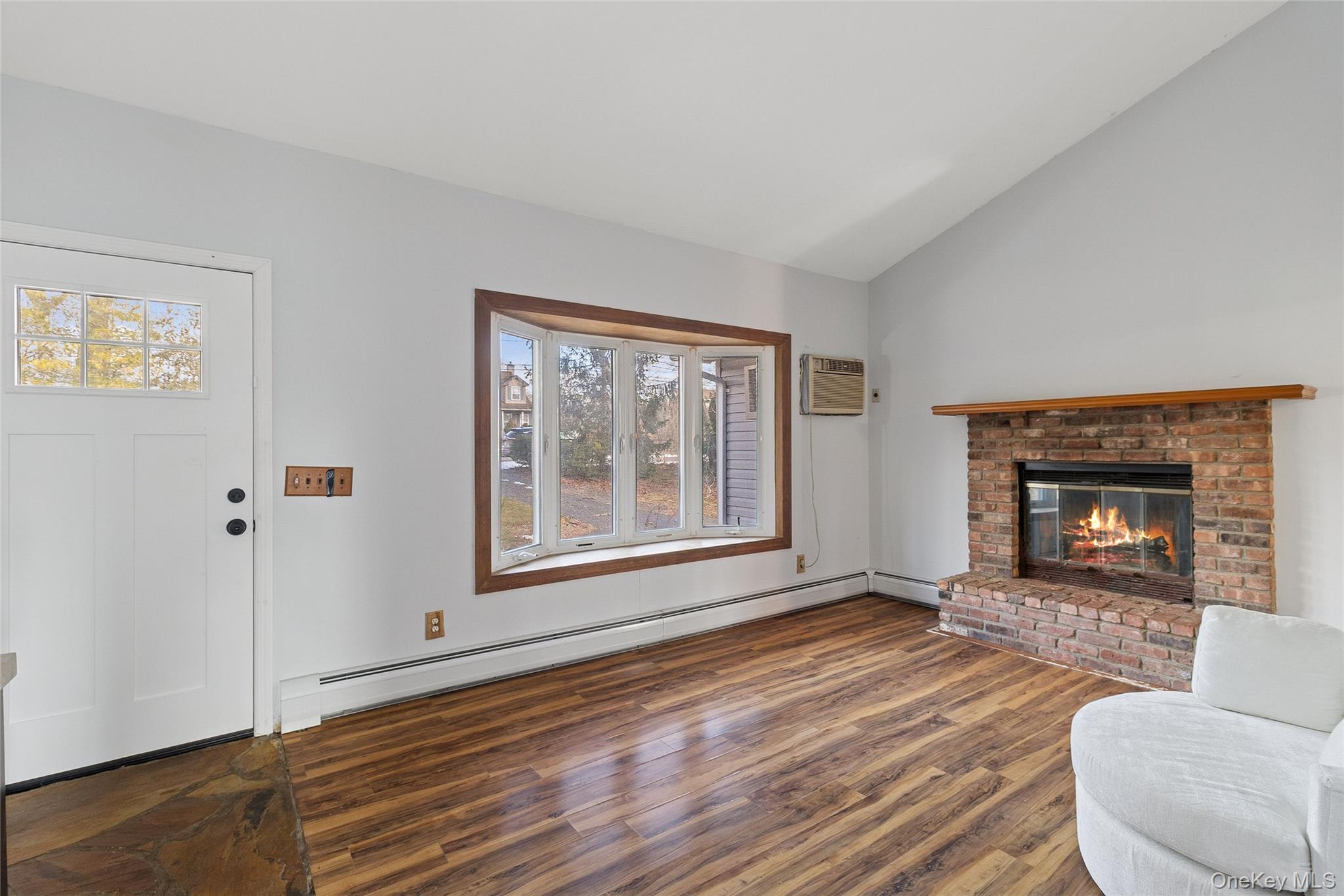 361 Decatur Avenue Shirley, NY 11967 - Photo 21 of 33 Living area with a brick fireplace,