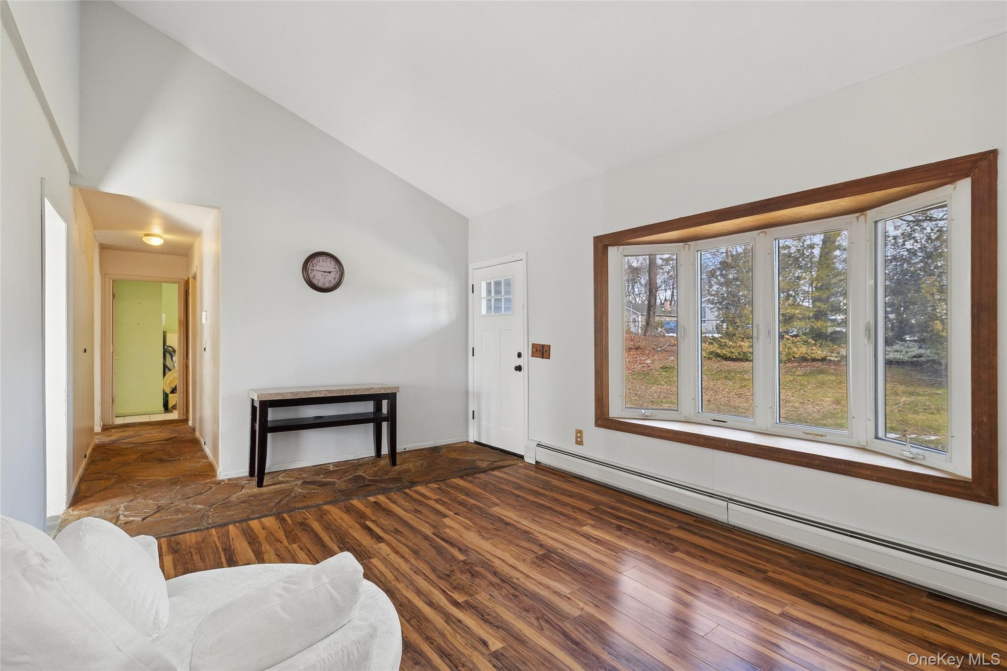 361 Decatur Avenue Shirley, NY 11967 - Photo 23 of 33 Living room featuring a Vaulted ceiling.