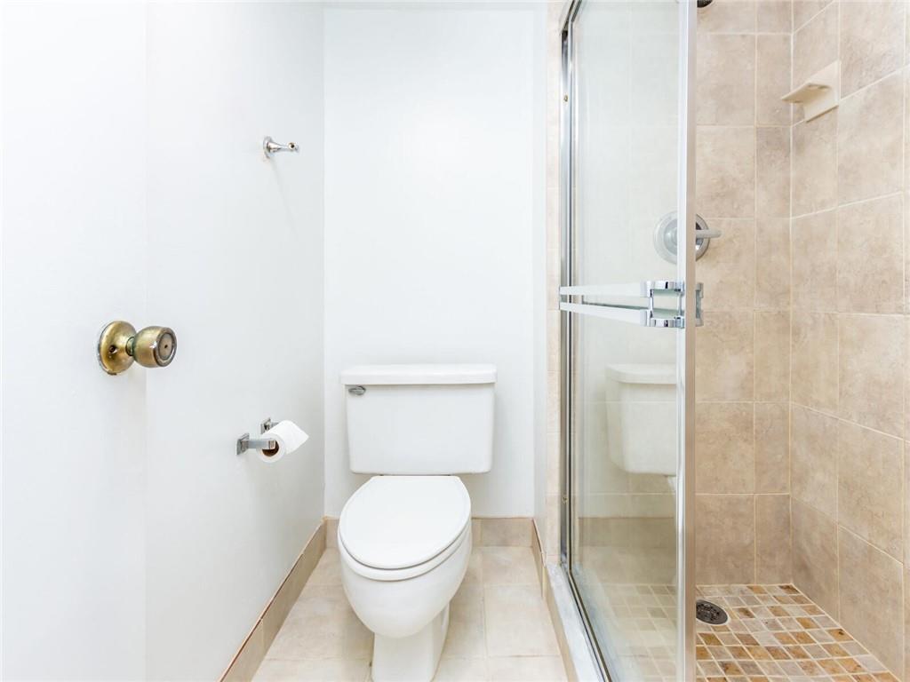 16243 Saddle Club Road, Unit 204 Weston, FL 33326 - Photo 32 of 48 a bathroom with a toilet and a shower