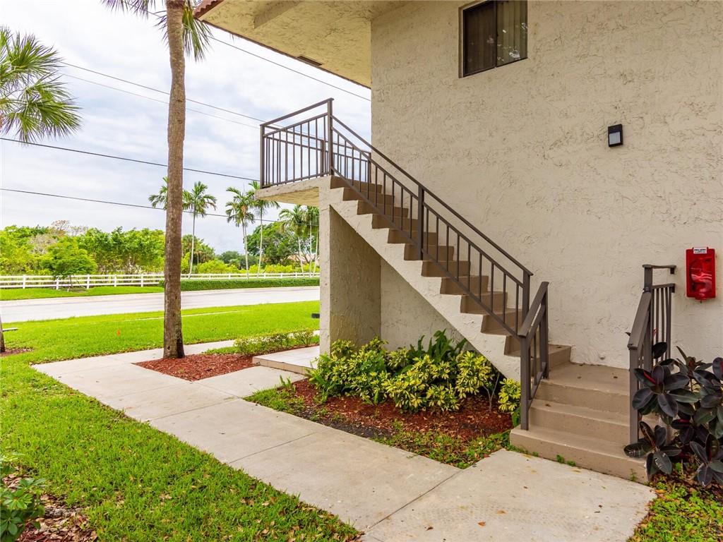 16243 Saddle Club Road, Unit 204 Weston, FL 33326 - Photo 44 of 48 a view of a garden with potted plants