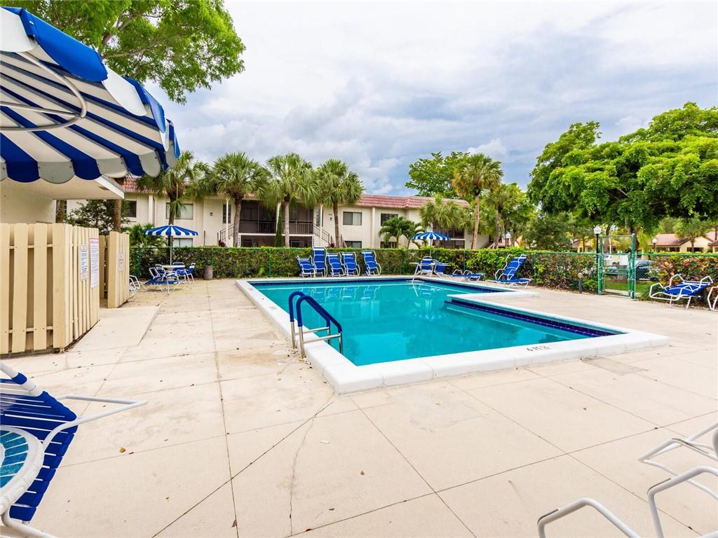 16243 Saddle Club Road, Unit 204 Weston, FL 33326 - Photo 46 of 48 a view of a swimming pool with a patio