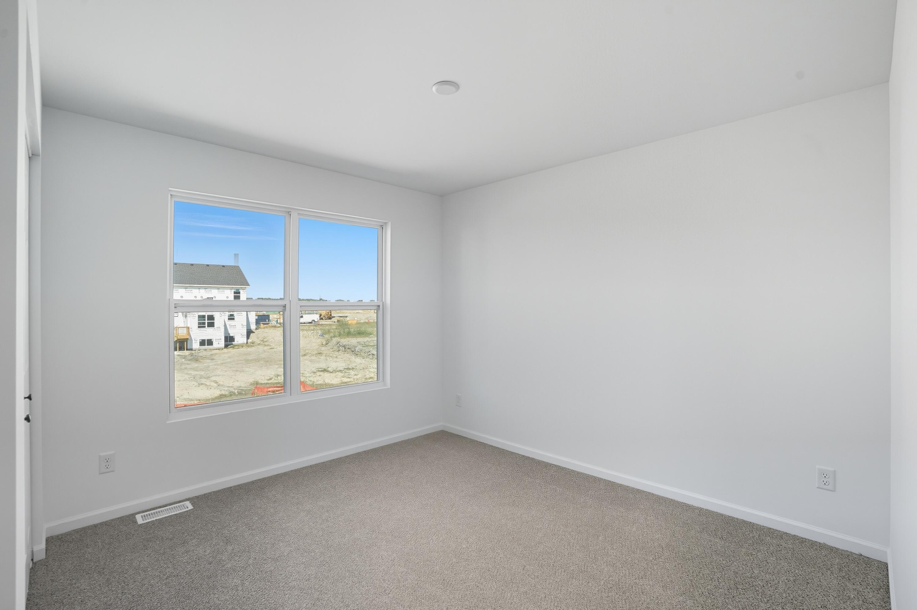 6866 East 104th Avenue Crown Point, IN 46307 - Photo 13 of 16 a view of an empty room with a window
